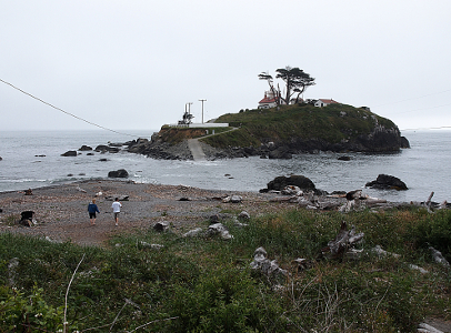 [Most of the paved drive can be seen in this image, however it now leads straight to water. The lighthouse looks as if it sits on an island as 200 horizontal feet of water separate it from the mainland.]